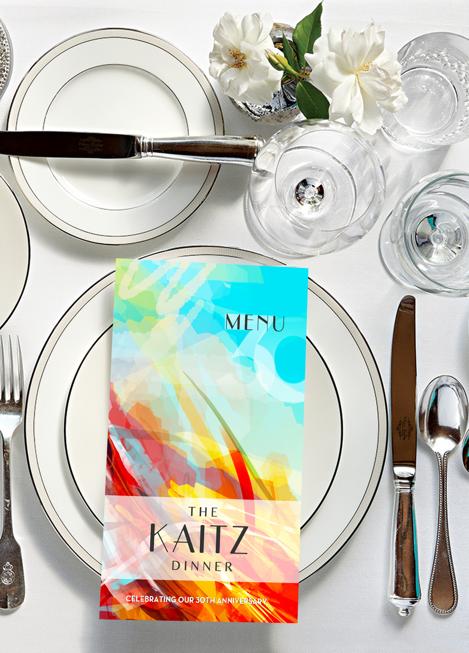 Table place setting with Kaitz Dinner Menu on the large plate